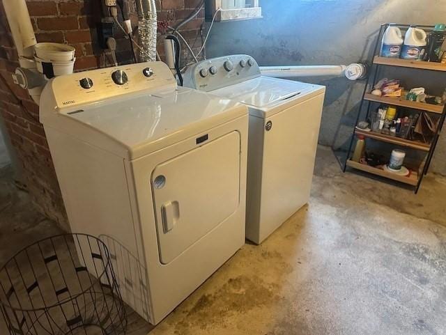 laundry area featuring independent washer and dryer and laundry area