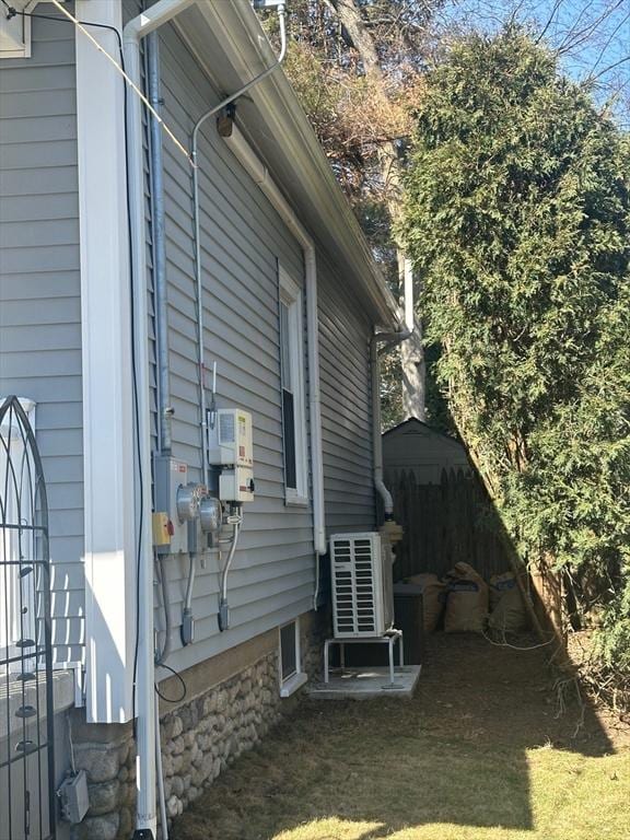 view of side of home with fence