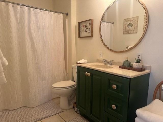 bathroom featuring vanity, tile patterned floors, curtained shower, and toilet