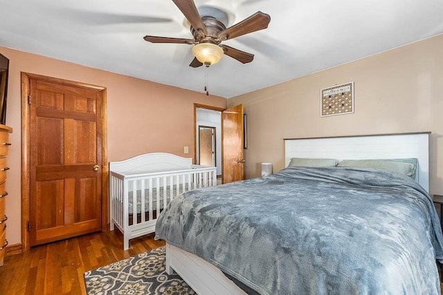 bedroom featuring wood finished floors and a ceiling fan