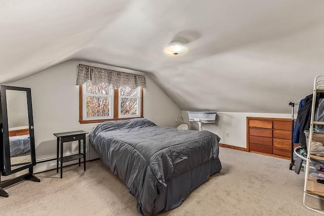 carpeted bedroom featuring baseboards, a baseboard heating unit, and vaulted ceiling