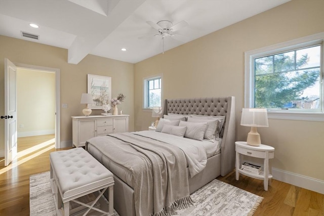 bedroom featuring recessed lighting, visible vents, baseboards, and wood finished floors