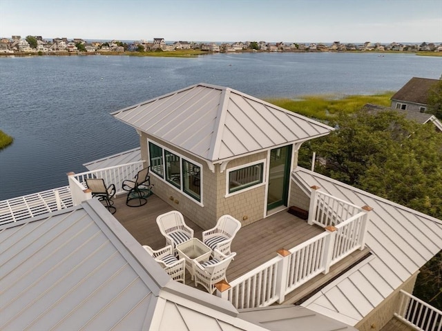 view of dock with a deck with water view