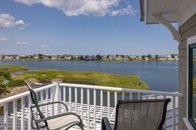 balcony featuring a water view