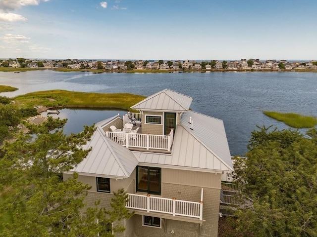 view of dock featuring a water view and a balcony