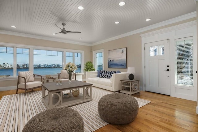 living room featuring recessed lighting, a water view, ornamental molding, light wood-style floors, and wooden ceiling