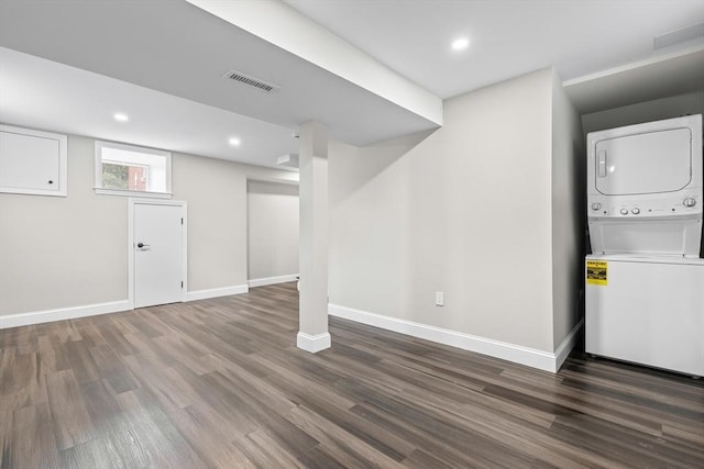 9 Bishop Rd, Quincy, MA 02170 - below grade area with stacked washer / dryer, wood finished floors, baseboards, and recessed lighting