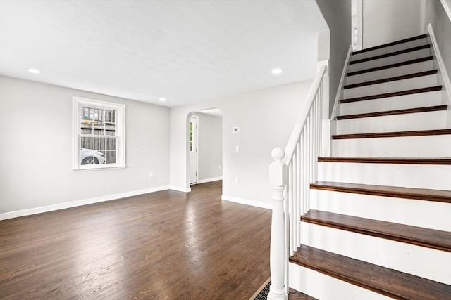 9 Bishop Rd, Quincy, MA 02170 - stairs featuring arched walkways, wood finished floors, baseboards, and recessed lighting