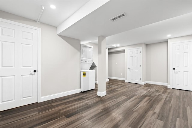 9 Bishop Rd, Quincy, MA 02170 - finished basement featuring stacked washer / dryer, dark wood finished floors, baseboards, and recessed lighting