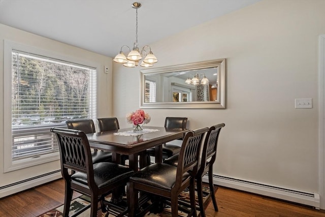 113 Glen Rd, Gorham, NH 03581 - dining room with a chandelier, a baseboard heating unit, and wood finished floors