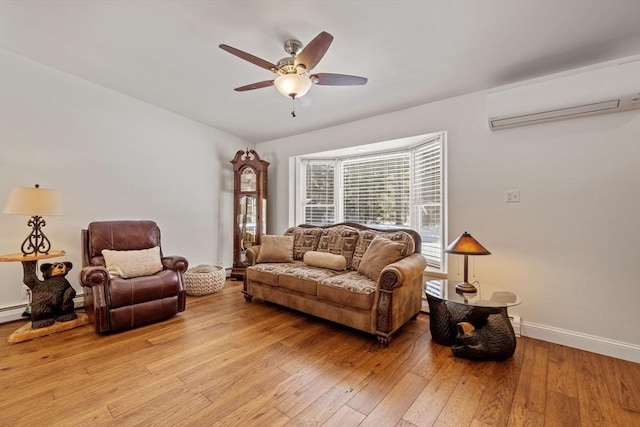 113 Glen Rd, Gorham, NH 03581 - living room with a wall unit AC, a ceiling fan, light wood-type flooring, and baseboards