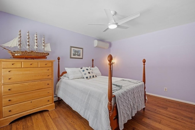 113 Glen Rd, Gorham, NH 03581 - bedroom with wood finished floors, an AC wall unit, baseboards, and ceiling fan