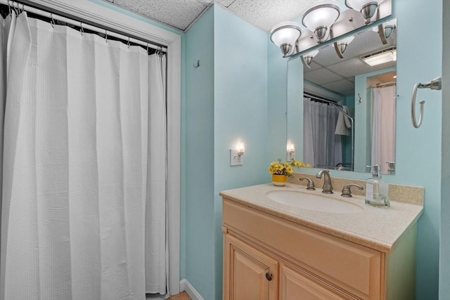113 Glen Rd, Gorham, NH 03581 - bathroom featuring a paneled ceiling and vanity