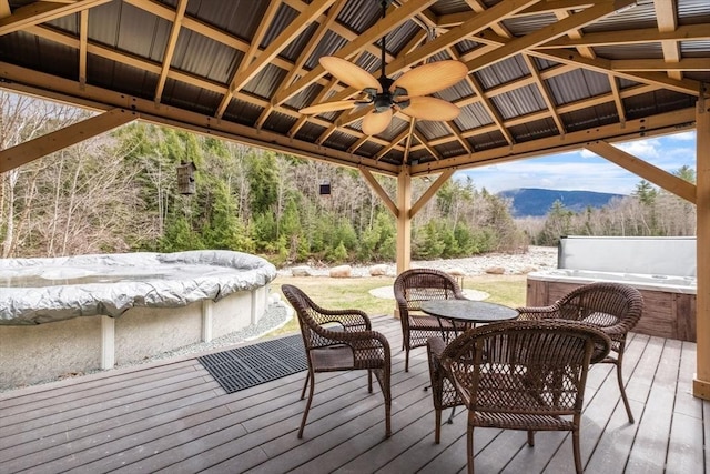 113 Glen Rd, Gorham, NH 03581 - wooden terrace featuring a gazebo, a mountain view, and a ceiling fan