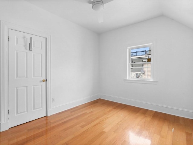 58 Oliver St Unit 2, Somerville, MA 02145 - unfurnished bedroom featuring light wood-style flooring, baseboards, vaulted ceiling, and a ceiling fan