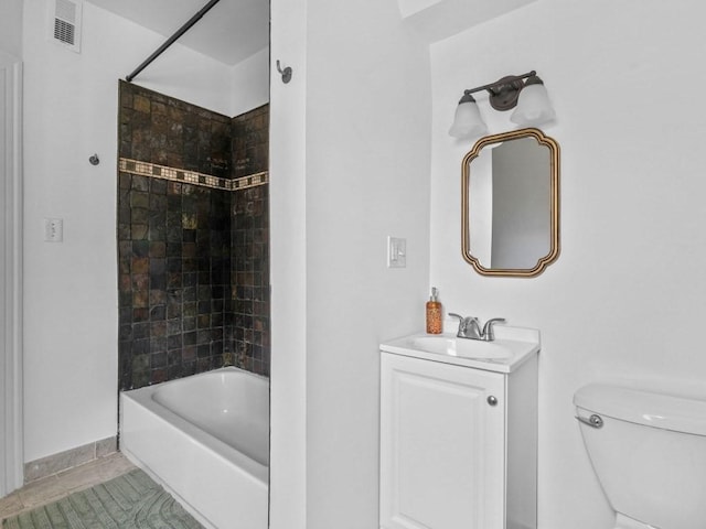 58 Oliver St Unit 2, Somerville, MA 02145 - full bath with vanity, toilet,  shower combination, and tile patterned flooring