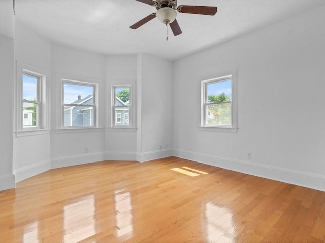 58 Oliver St Unit 2, Somerville, MA 02145 - spare room with light wood-style floors, baseboards, and ceiling fan