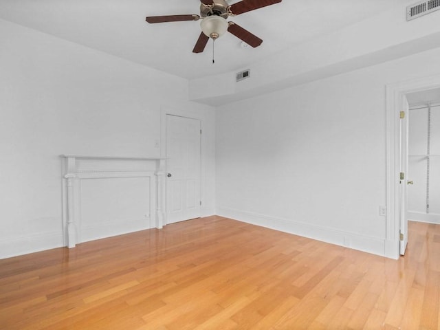 58 Oliver St Unit 2, Somerville, MA 02145 - spare room with light wood-type flooring, a ceiling fan, and baseboards