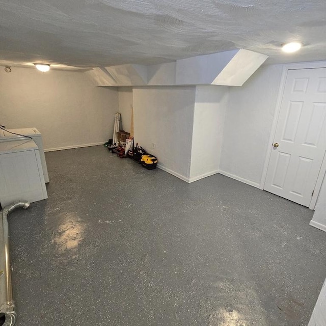 58 Oliver St Unit 2, Somerville, MA 02145 - finished below grade area with baseboards, a textured ceiling, and washer / dryer