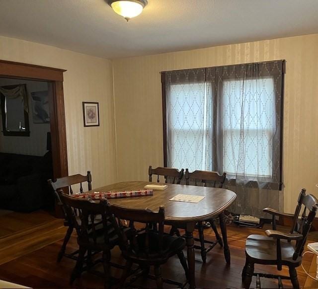 dining area with dark wood-type flooring