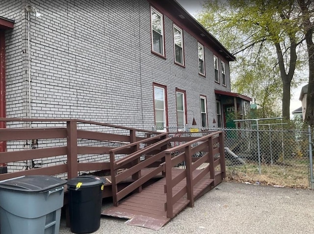 view of home's exterior featuring fence