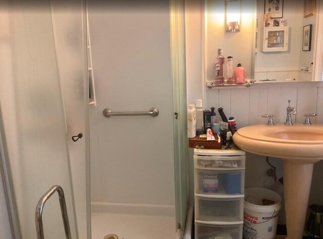bathroom with a shower stall