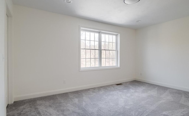 unfurnished room featuring carpet floors