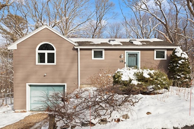 view of front of property with a garage