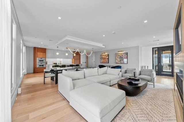 living room with recessed lighting and light wood finished floors
