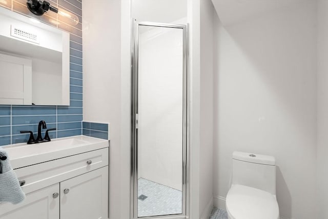 323 Lake Ave Unit 323, Newton, MA 02461 - bathroom with toilet, a shower stall, decorative backsplash, vanity, and baseboards
