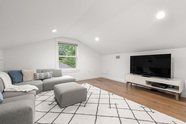 323 Lake Ave Unit 323, Newton, MA 02461 - living area featuring wood finished floors, baseboards, vaulted ceiling, and recessed lighting