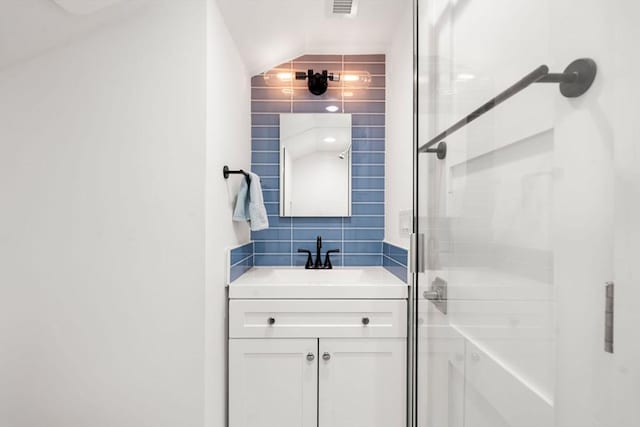 323 Lake Ave Unit 323, Newton, MA 02461 - bathroom with a shower stall, vanity, and tasteful backsplash