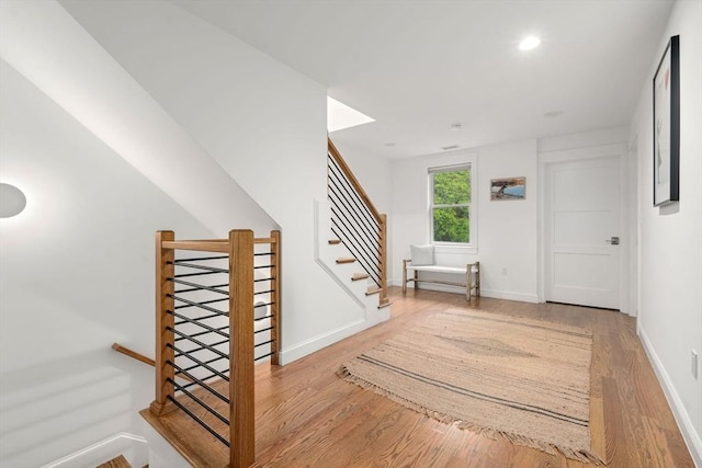 323 Lake Ave Unit 323, Newton, MA 02461 - foyer with wood finished floors, baseboards, and recessed lighting