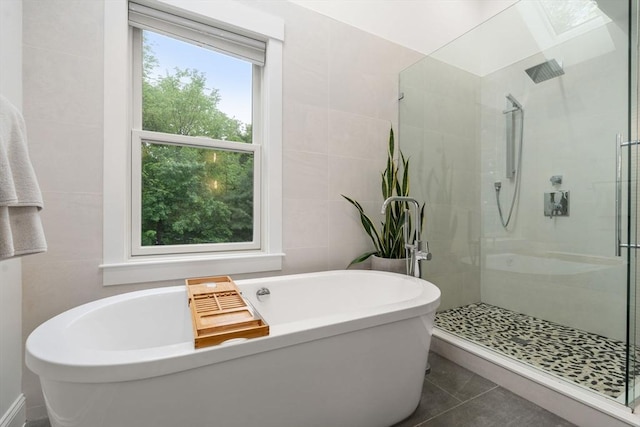323 Lake Ave Unit 323, Newton, MA 02461 - bathroom with tile walls, a stall shower, tile patterned floors, and a soaking tub