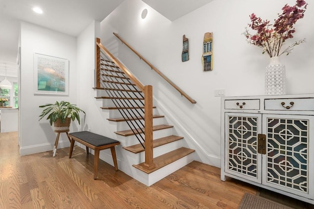 323 Lake Ave Unit 323, Newton, MA 02461 - stairway featuring wood finished floors, baseboards, and recessed lighting