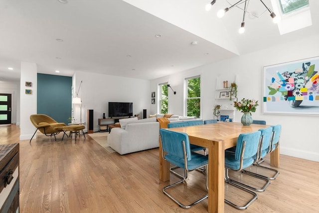 323 Lake Ave Unit 323, Newton, MA 02461 - dining area featuring light wood-type flooring, a skylight, baseboards, recessed lighting, and lofted ceiling