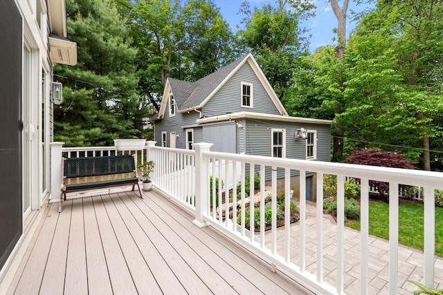 323 Lake Ave Unit 323, Newton, MA 02461 - deck with view of scattered trees and a detached garage