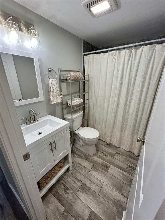 1 Sunderland Ter, Worcester, MA 01604 - bathroom featuring vanity, wood finish floors, and a shower with curtain