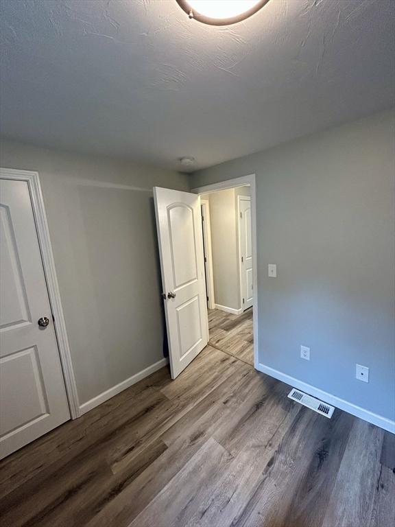 1 Sunderland Ter, Worcester, MA 01604 - spare room with wood finished floors and baseboards