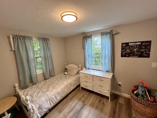 1 Sunderland Ter, Worcester, MA 01604 - bedroom featuring wood finished floors and multiple windows