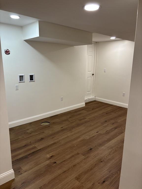 laundry room with dark wood-type flooring and washer hookup