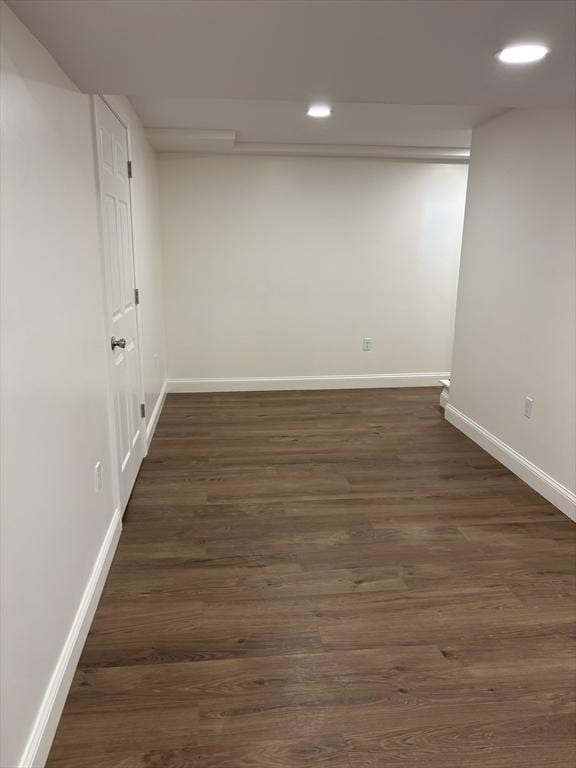 basement featuring dark hardwood / wood-style flooring