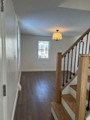 stairs featuring hardwood / wood-style flooring