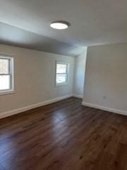 spare room featuring dark hardwood / wood-style floors