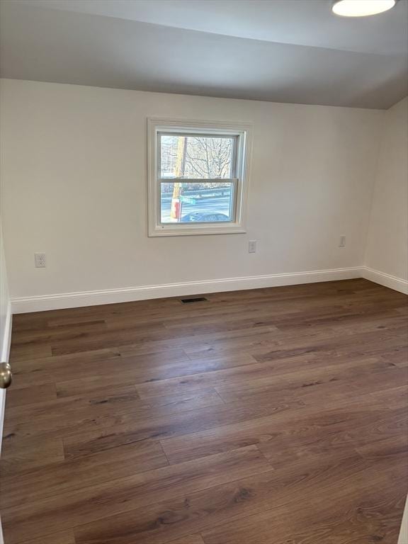 unfurnished room featuring dark hardwood / wood-style floors