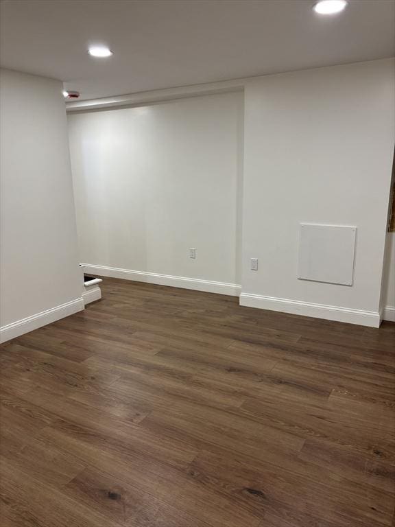 spare room with dark hardwood / wood-style flooring