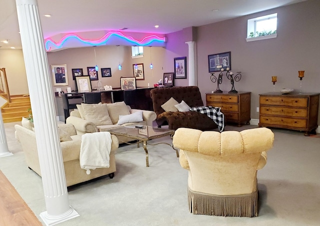 carpeted living room with ornate columns