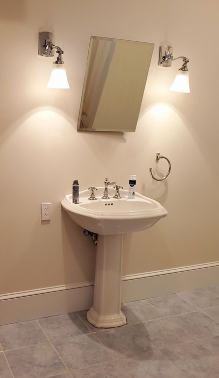 bathroom featuring tile floors