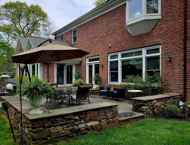 back of property with a patio area