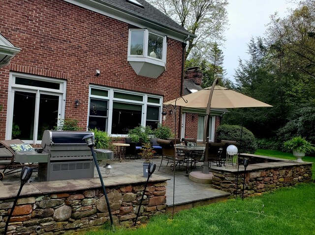 back of house with a patio area